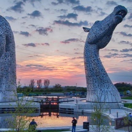 Kelpie statues at sunset